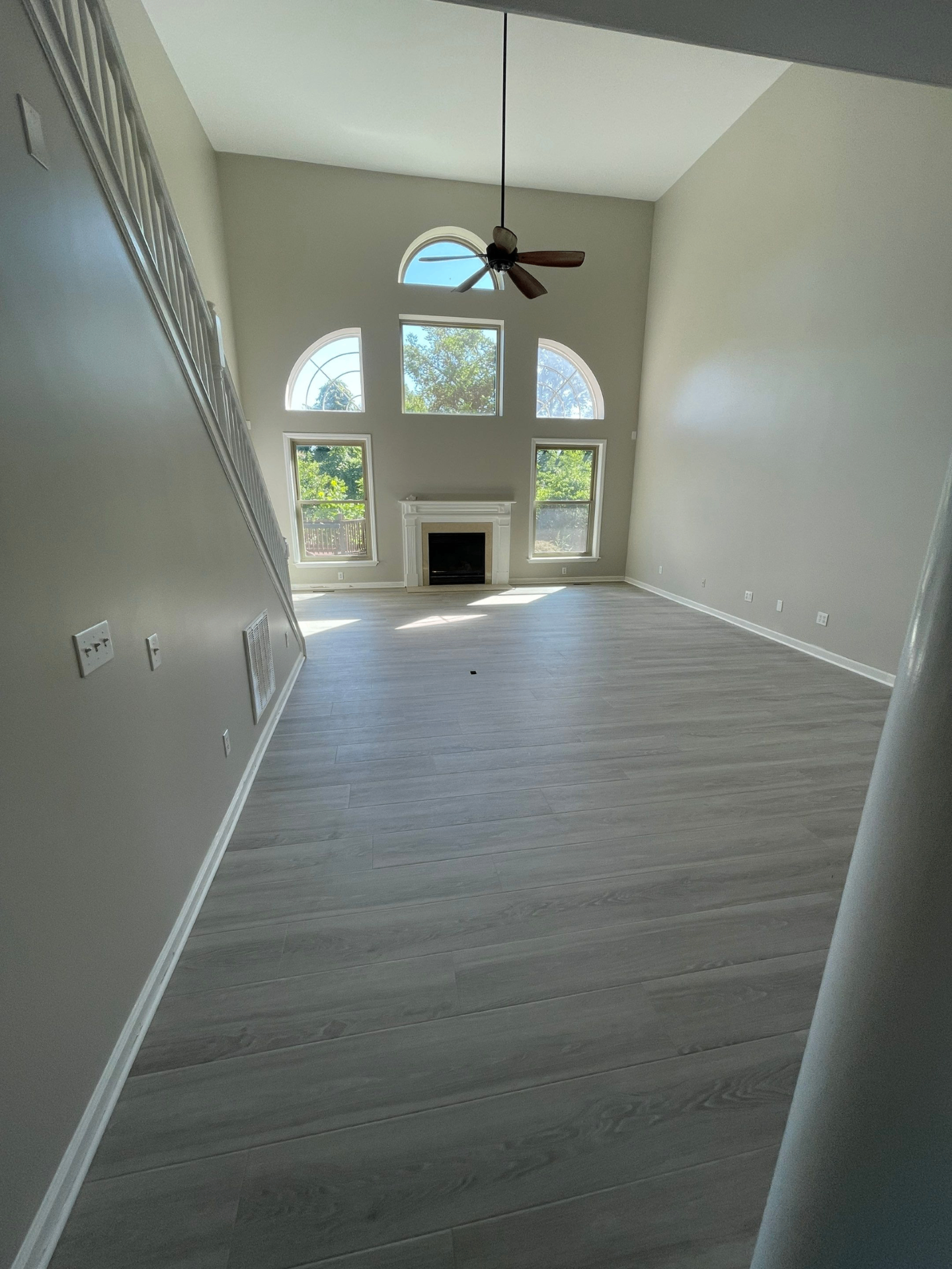 Great room after reconstruction - new flooring, paint, and finished trim